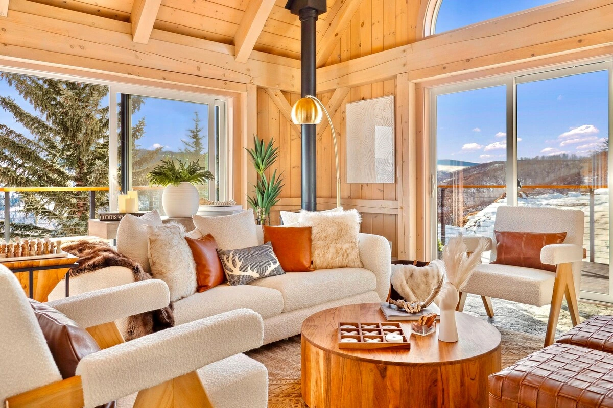 Alpine retreat with timber ceilings and inviting ivory seating