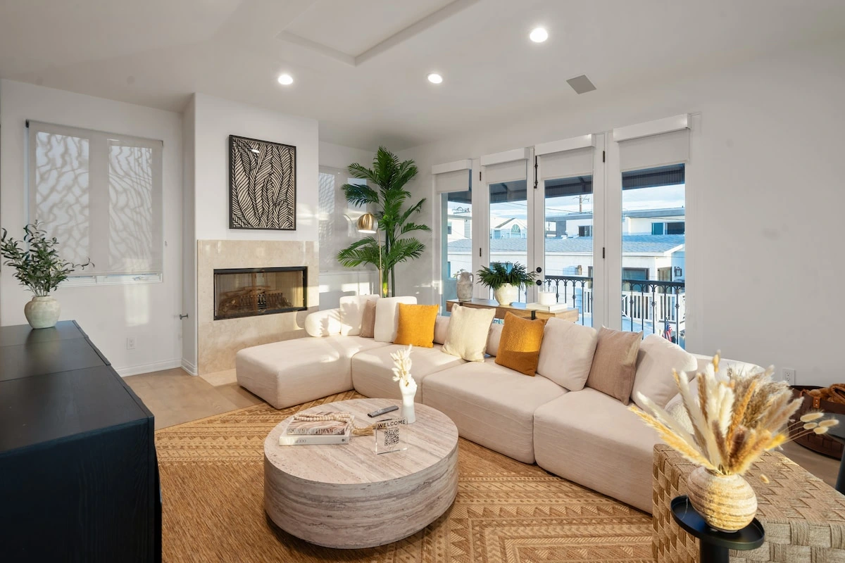 Manhattan Beach living room with a white sectional and warm golden accents